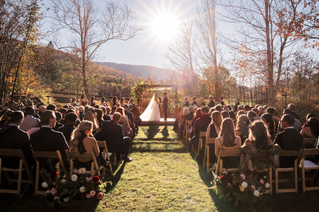 Outdoor ceremony with mountain views at a Hudson Valley wedding venue during golden hour