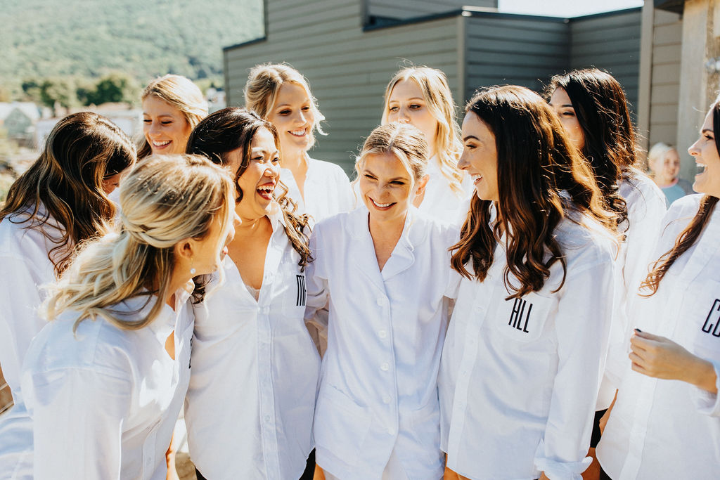 bride and bridesmaids in white pajamas
